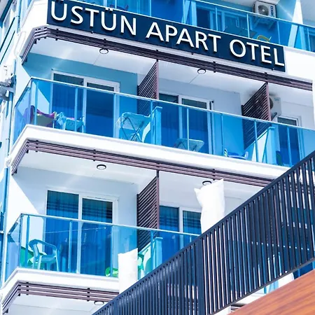 üstün *